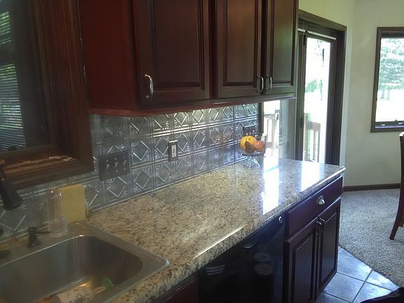Ideal for entertaining any season!
						:
						Granite counter tops & an island w/seating makes this kitchen user friendly.