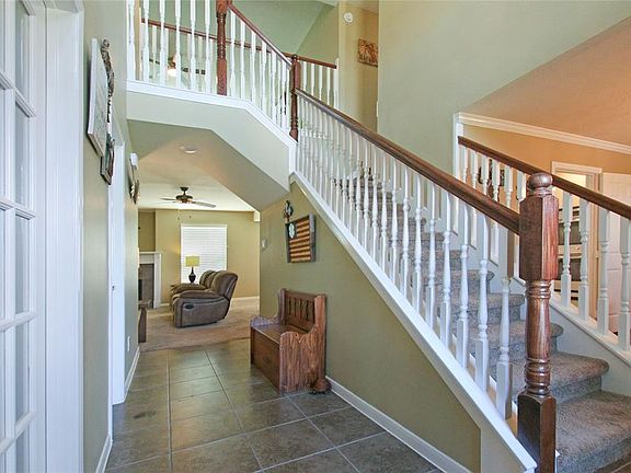Enter into this beautiful home with double stairs upstairs.