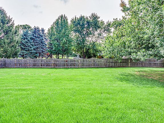 Wood fenced-in backyard.