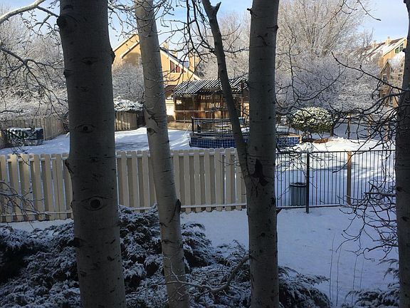 View of pool and hot tub in winter