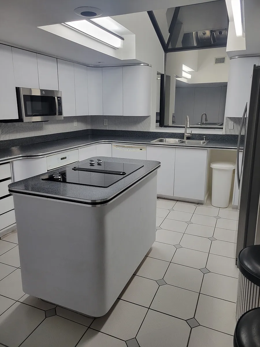 Light and bright kitchen with abundant cabinet storage including a whole wall pantry! - 178 Turnberry Cir