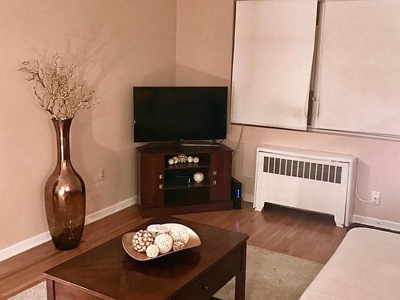 Living Room With 2 Large Windows & A/C