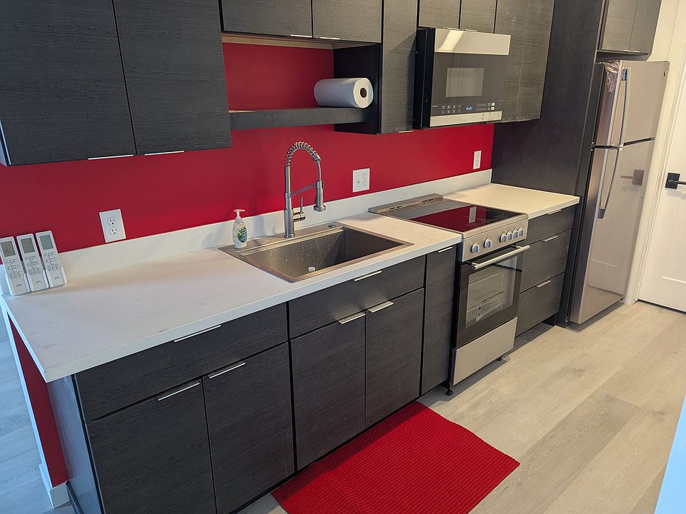Deep stainless steel sink and solid surface countertops