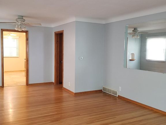 huge bright living room and dining area with all new blinds and beautiful hardwood floors!