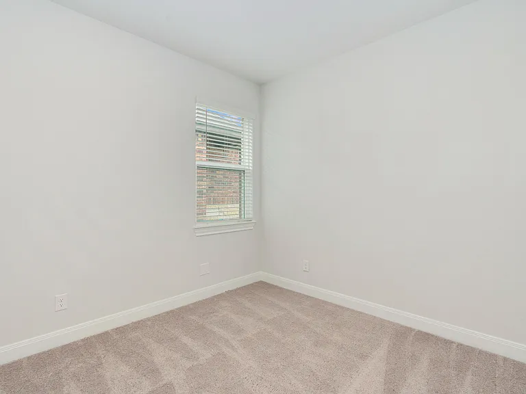 The secondary bedrooms have lush carpet.