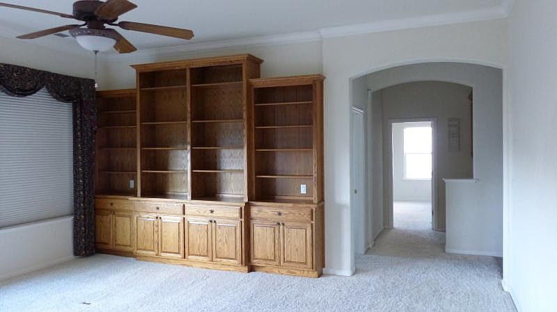 Built-in library in the family room.