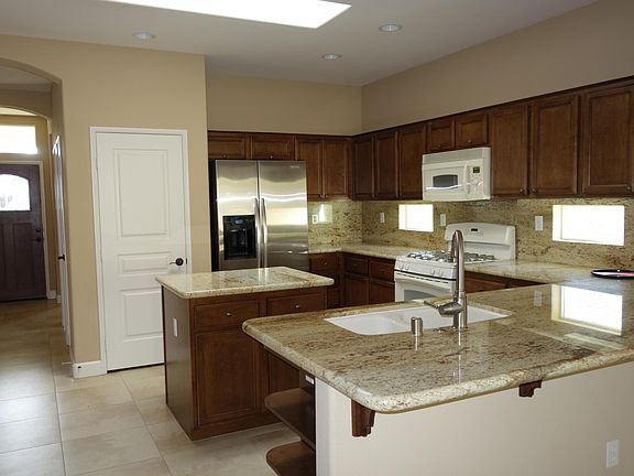 Granite counters, stove, refrigerator, microwave, dishwasher