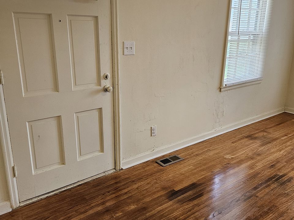 Living room with door that exits on east side of home
