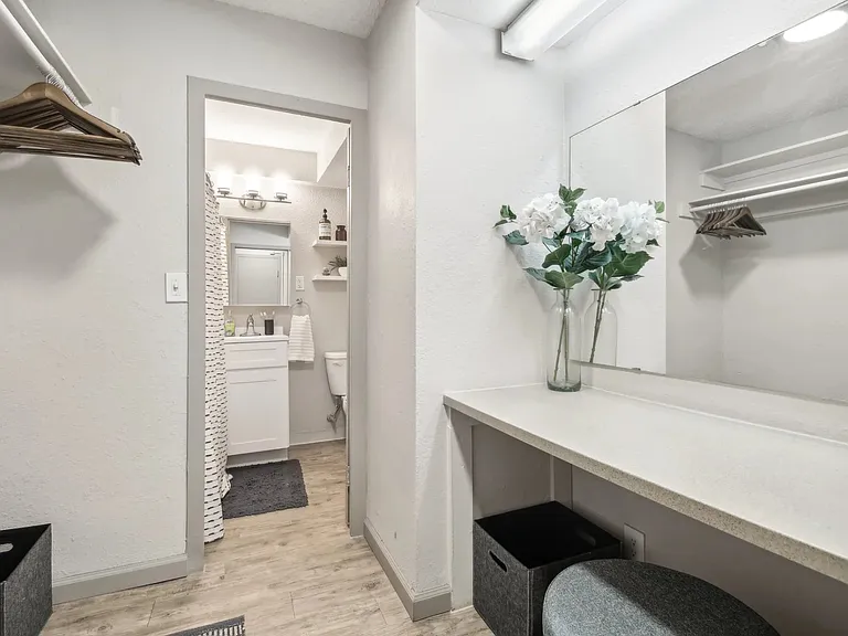 Large vanity area outside of the chic bathroom at Archer Tower in Denver, CO