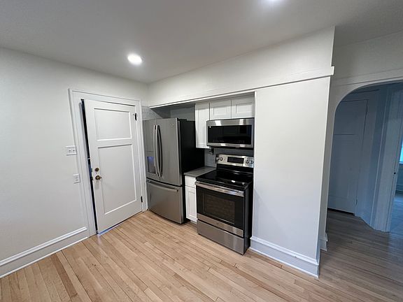 Photo of kitchen looking south, fridge has water dispenser