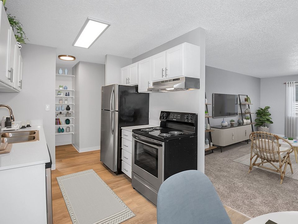 Kitchen with stainless-steel appliances and beautiful wood flooring