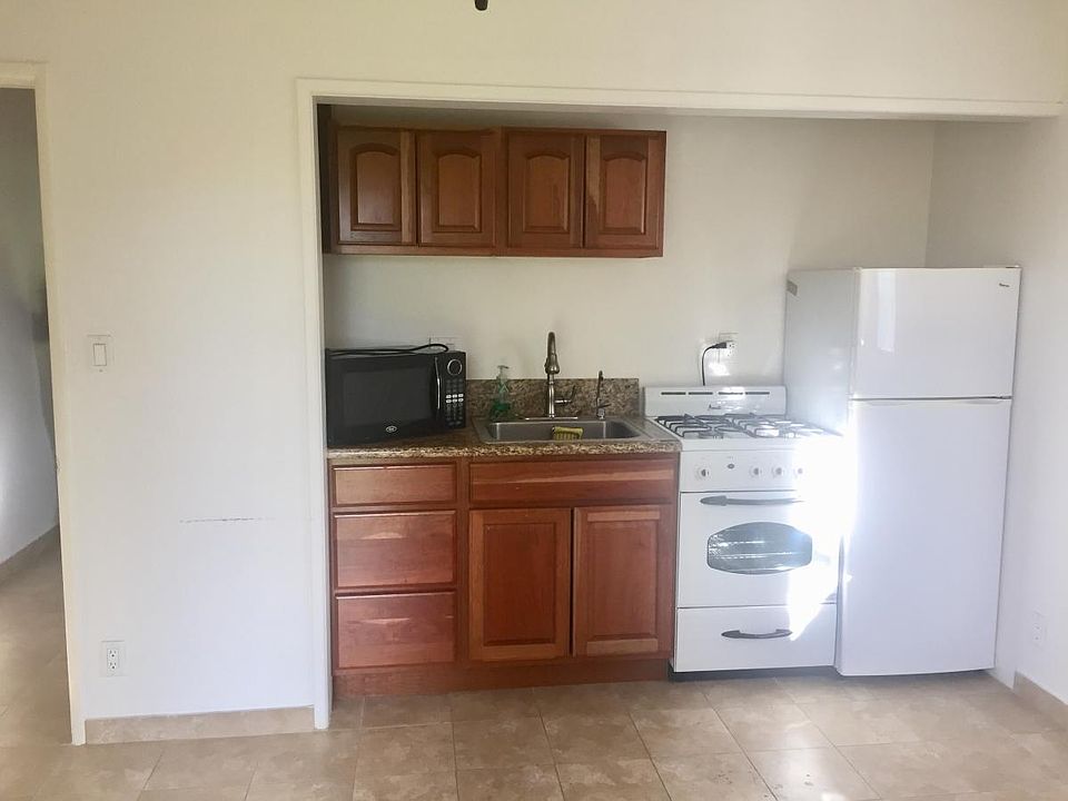 Little kitchenette with a refrigerator stove. Microwave.