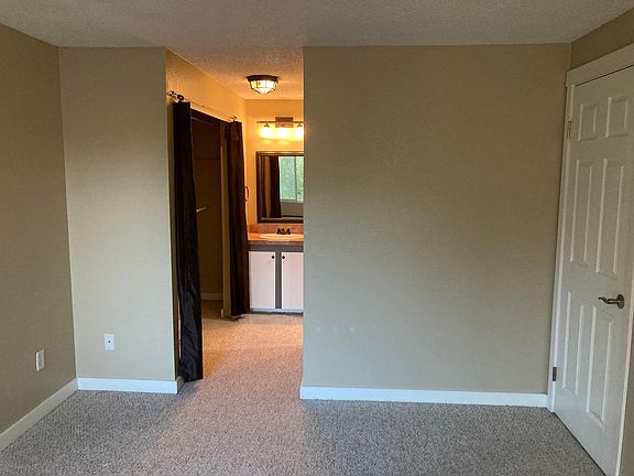 Bedroom #1 with closet and vanity.