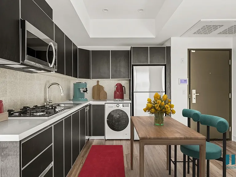 Open-Concept Kitchen with Refrigerator, Dishwasher, Washer/Dryer, Range Stovetop, and Microwave Oven - Palm Floor Plan