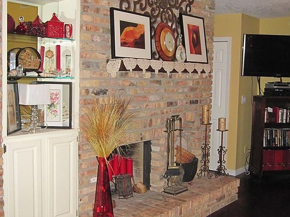 family room with brick fireplace 