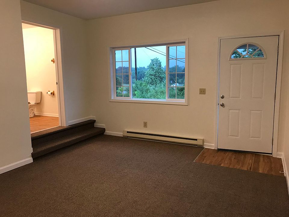Living room; bathroom visible to left