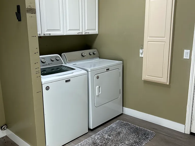 Laundry room washer and dryer and ironing board