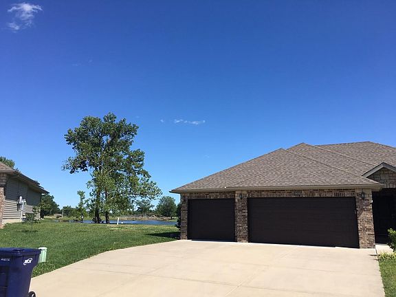 View of Front of House w/ Lake in Background