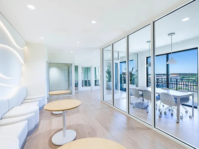 Coworking spaces with comfortable seating areas, private workstations, and conference rooms.