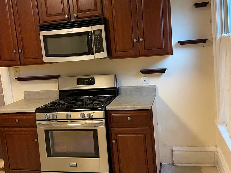 Newer gas stove and used cherry cabinets