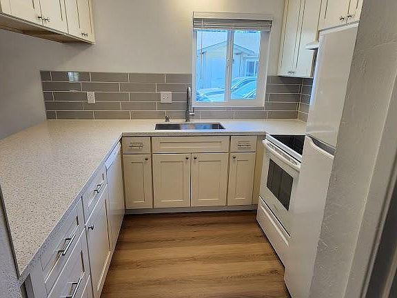 Completely remodeled kitchen with new appliances, counters, and cabinets