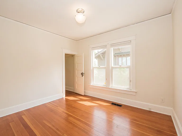 primary bedroom gets a lot of light through two south facing windows