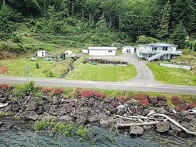 Arial view from over the river looking back to the house