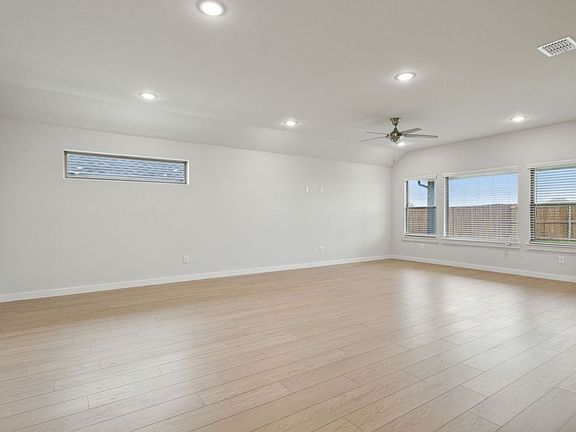 Living Room in the Oscar home plan by Trophy Signature Homes - REPRESENTATIVE PHOTO