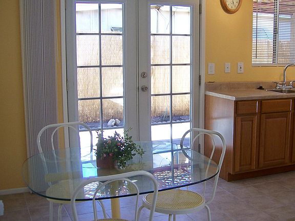New French Doors at Dining Room enter to outdoor entertaining area.