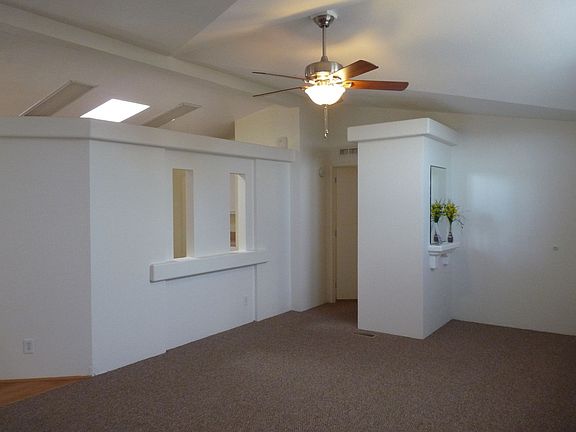 Living Room looking toward MBedroom - note Kitchen skylight