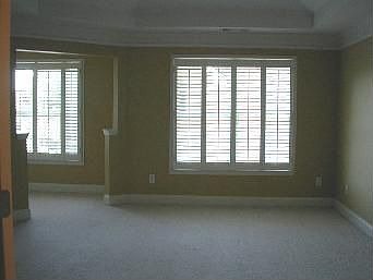 spacious master suite w tray ceiling, enormous closet space, plantation shuter