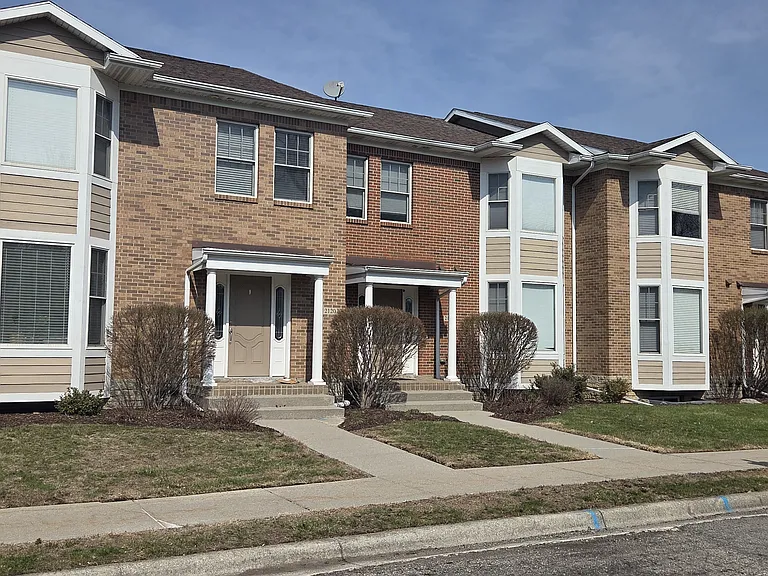 Front of townhome complex. Unit is 2nd from the left