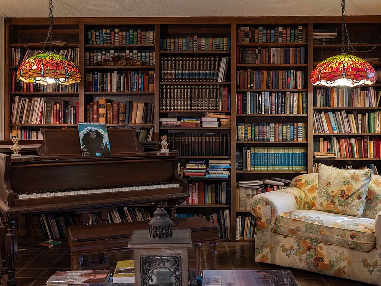 Relax, read, and unwind in this cozy library space.