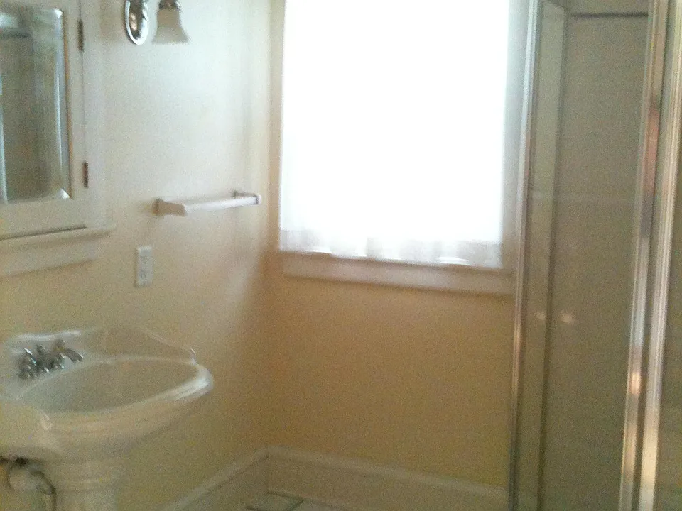 Bathroom with walk-in shower.