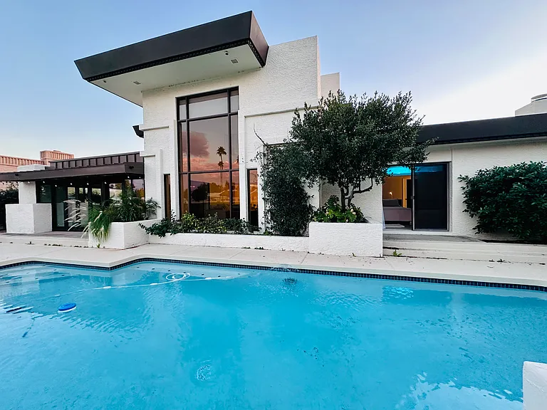 Backyard of the house with swimming pool.
