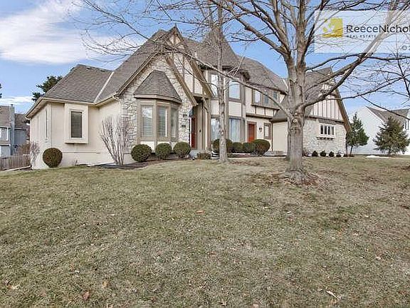 Mature trees surround this home