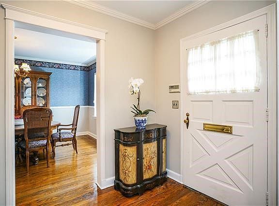 Inviting entry with pretty architectural moldings.