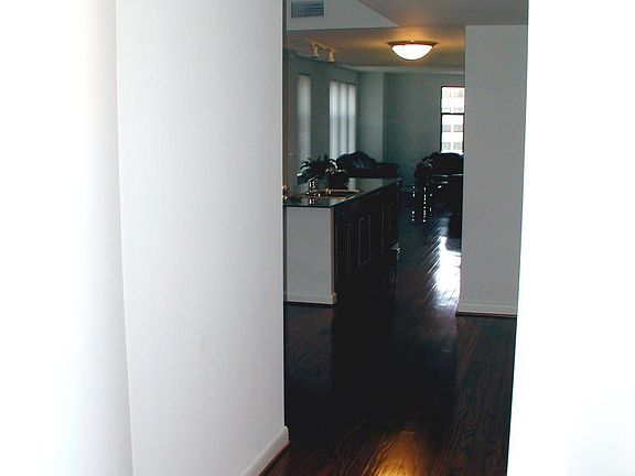 Hallway Opening to Kitchen-Living Room Area