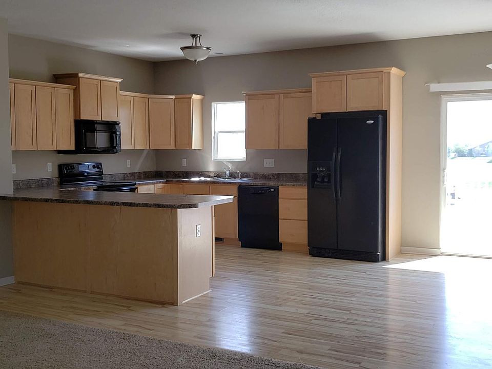 Kitchen with dining area and walkout deck