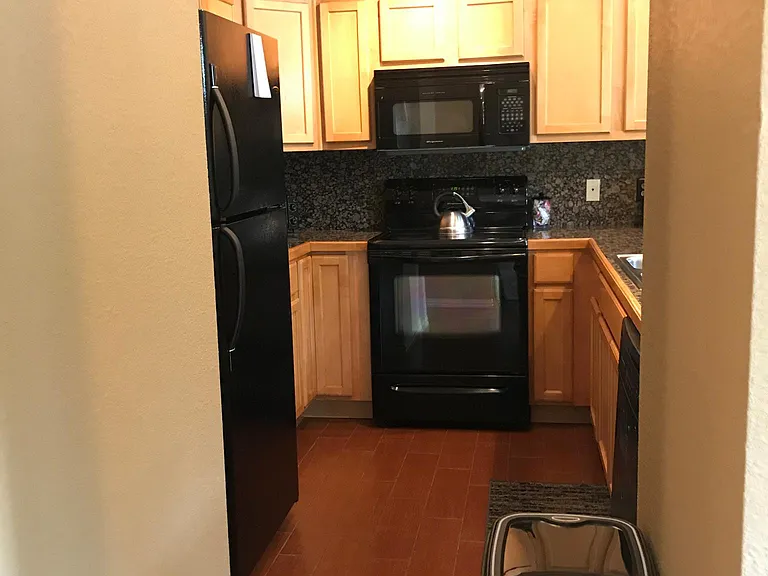 Kitchen w/ Fridge, Oven, Microwave, and Dishwasher