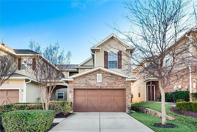 Front of property. 2-car garage
