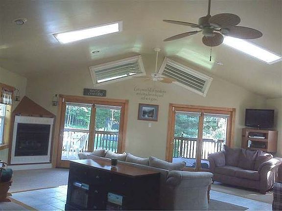 Beautiful Great Room with Vaulted Ceiling, Skylights, opens to Hot Tub area