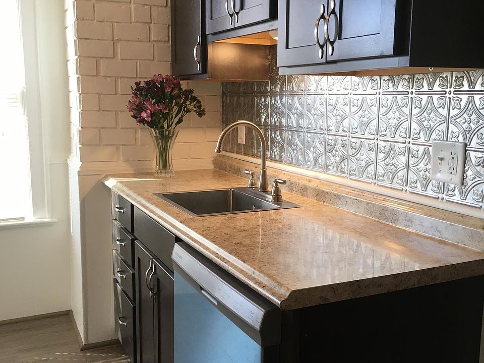 Fully renovated kitchen complete with dishwasher, oven and fridge. Custom built cabinets. New windows and flooring.