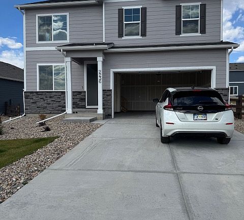 House entrance, 2 car garage, long driveway (fits 6 cars)