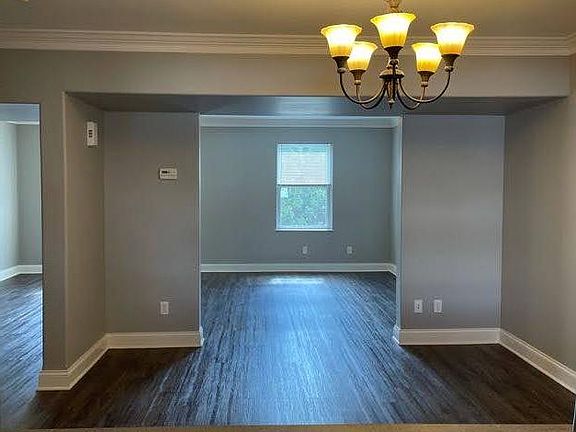 view from kitchen through dining room to living room