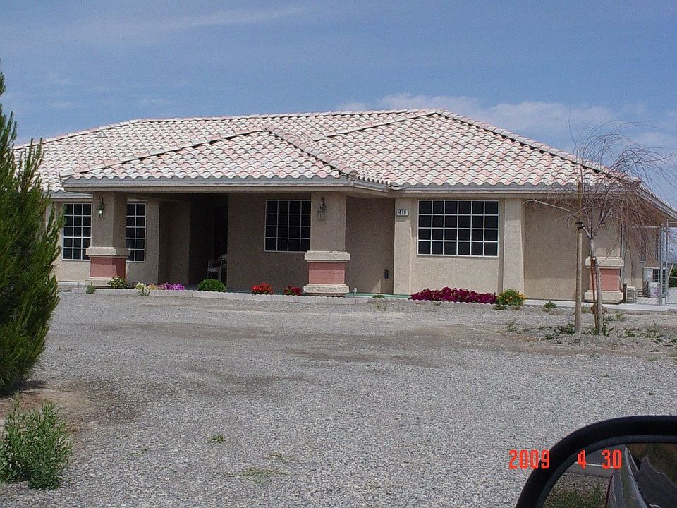 Front, tile roof. 1 story
