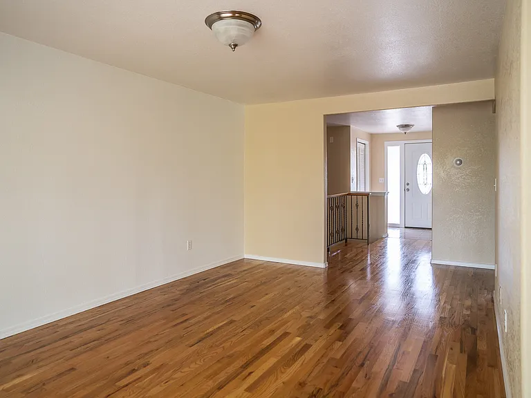 Living room with view into entryway