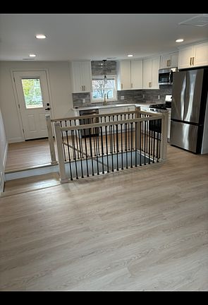Open concept living room/kitchen/dining area