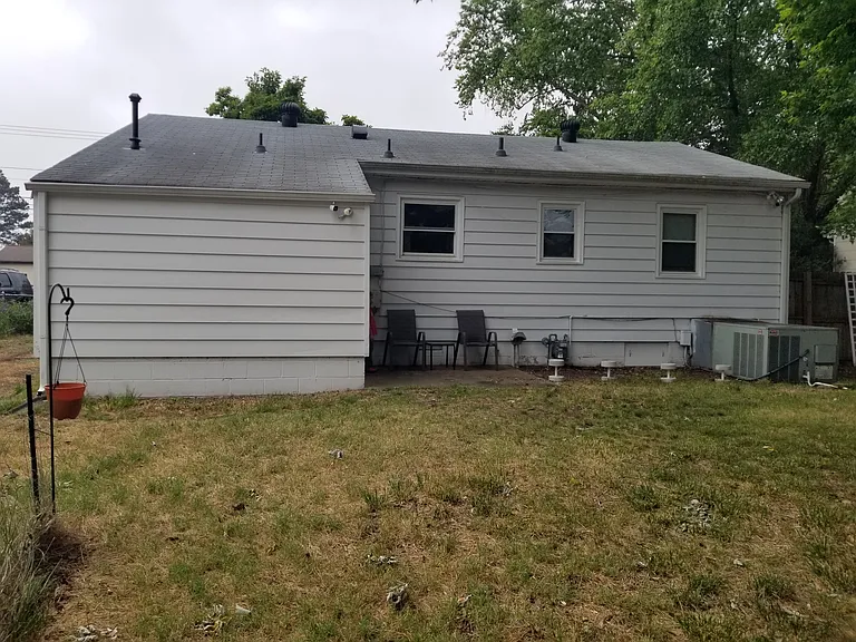 Backside of house showing yard.
Backyard door is to the left of the chairs leading into the laundry room.