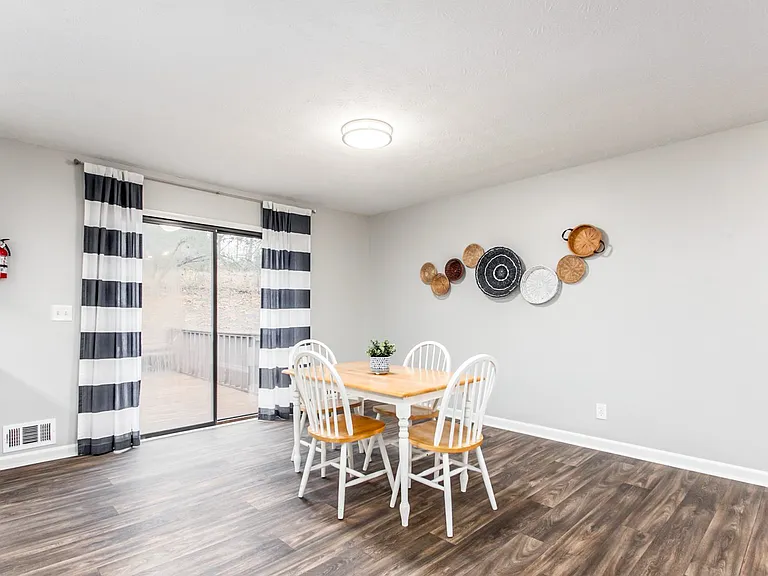 Spacious dining area with glass doors to the back deck.